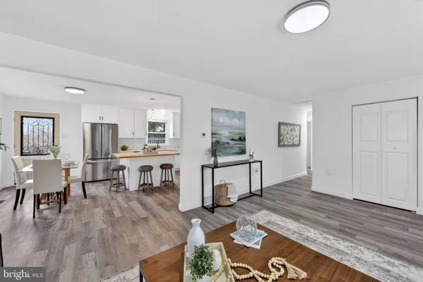 a living room with furniture wooden floor and a table
