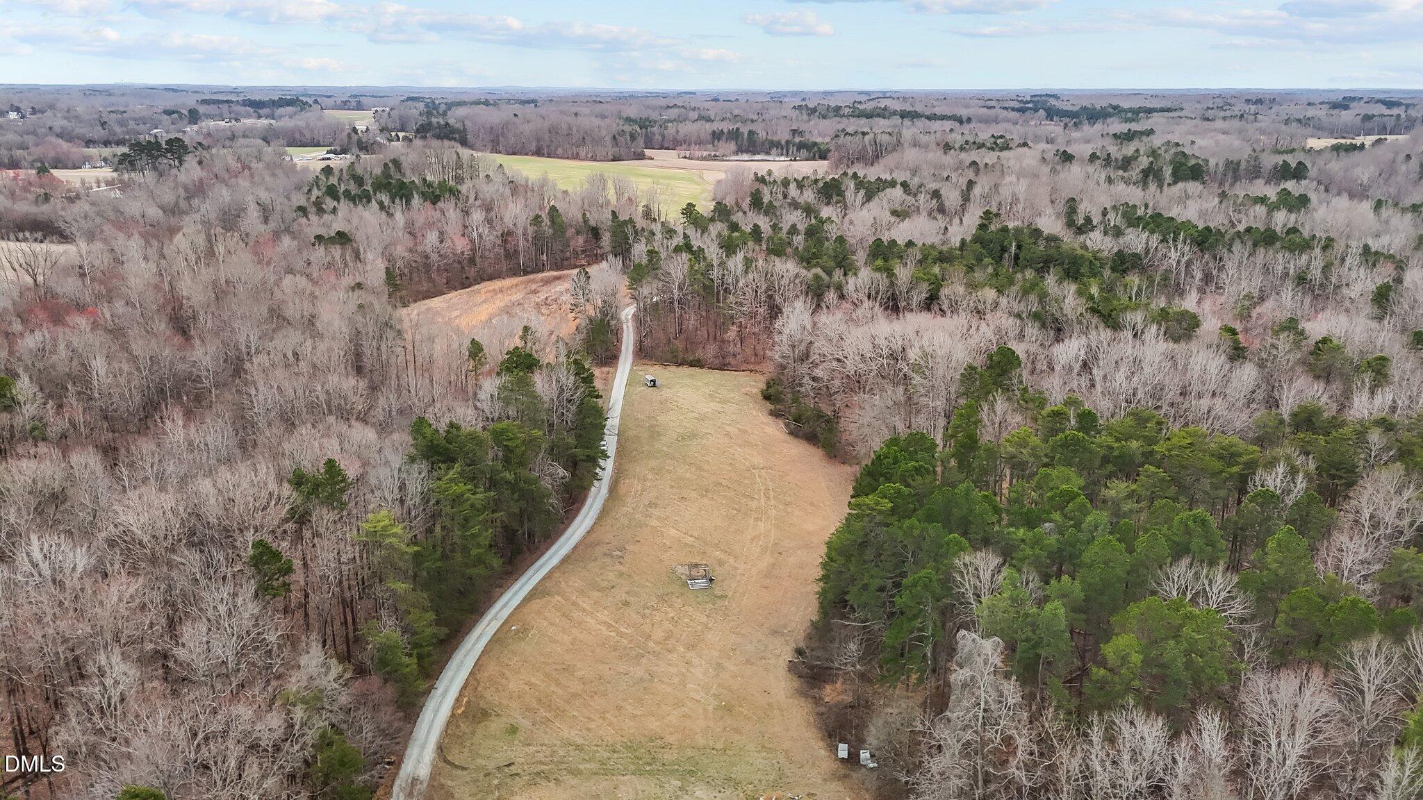 8729 Allison Road Cedar Grove, NC 27231 - Photo 49 of 63 a view of a dry yard with trees