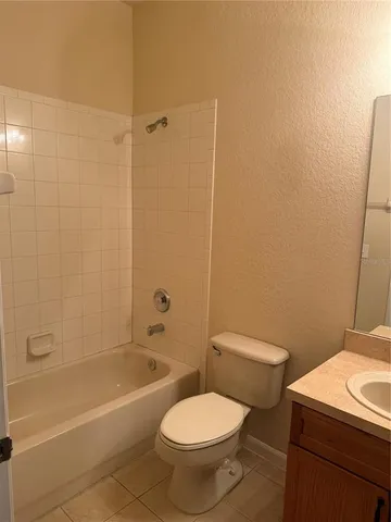 a bathroom with a sink a toilet and a bathtub