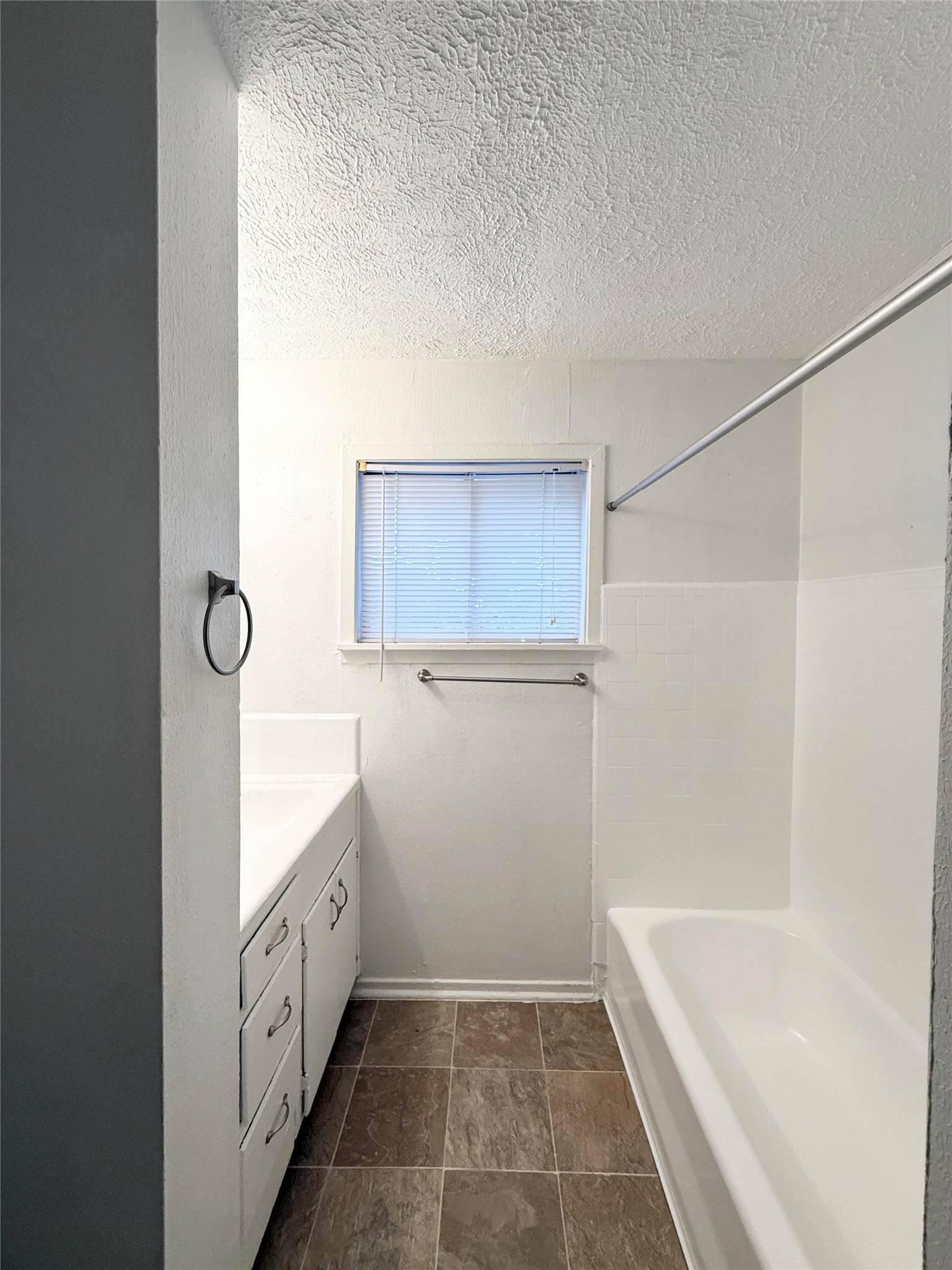 3629 North MacGregor Way, Unit 3 Houston, TX 77004 - Photo 12 of 14 a bathroom with a tub sink and mirror