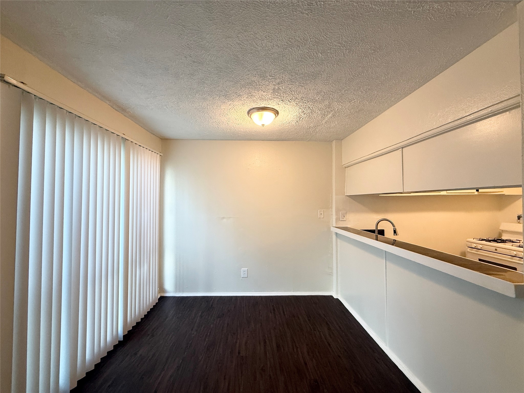 3629 North MacGregor Way, Unit 3 Houston, TX 77004 - Photo 5 of 14 a view of an empty room with wooden floor