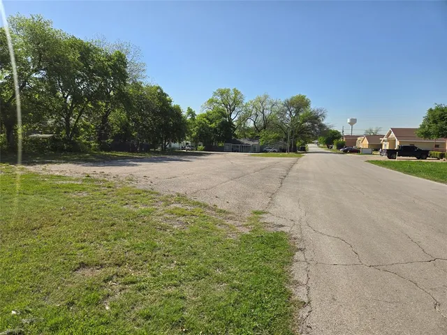 a view of city with the shops and fruits