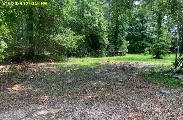 8105 Kestrel E Road Orange, TX 77632 - Photo 1 of 5 a view of outdoor space with trees all around