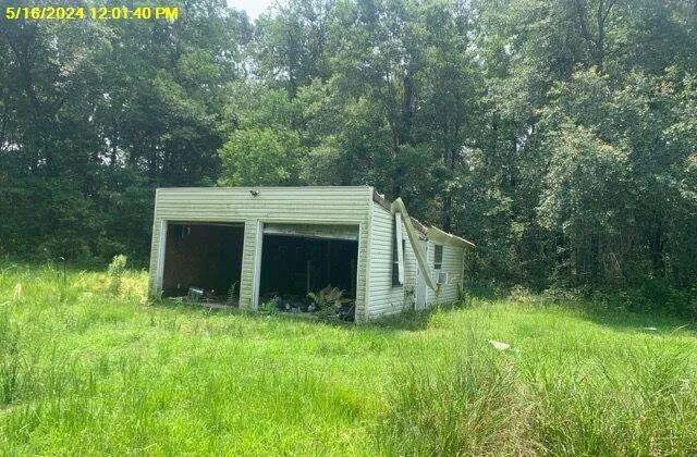 a view of backyard with green space