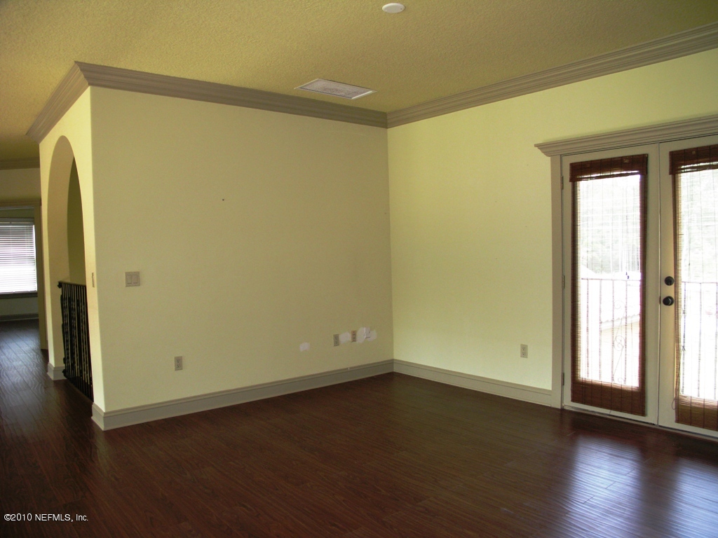 1360 Roberts Road St. Johns, FL 32259 - Photo 33 of 39 an empty room with wooden floor and a window