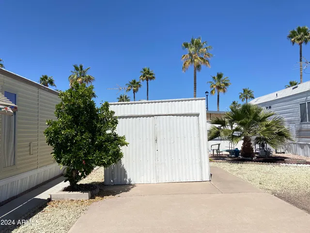a view of a house with a flower garden