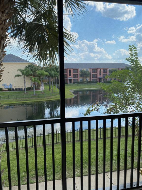 10825 Windsor Walk Drive, Unit 3201 Orlando, FL 32837 - Photo 10 of 10 a view of a brick house with a large windows and a table