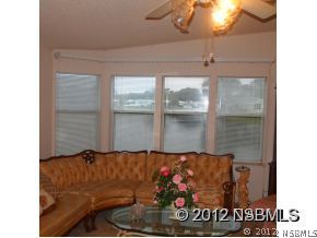 746 Navigators Way Edgewater, FL 32141 - Photo 11 of 14 a living room with furniture