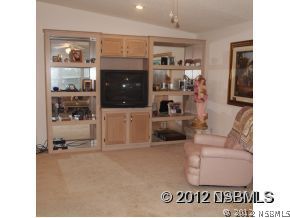 746 Navigators Way Edgewater, FL 32141 - Photo 12 of 14 a living room with furniture and a window