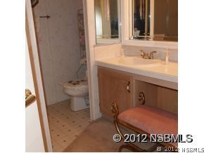 746 Navigators Way Edgewater, FL 32141 - Photo 3 of 14 a bathroom with a sink and a toilet