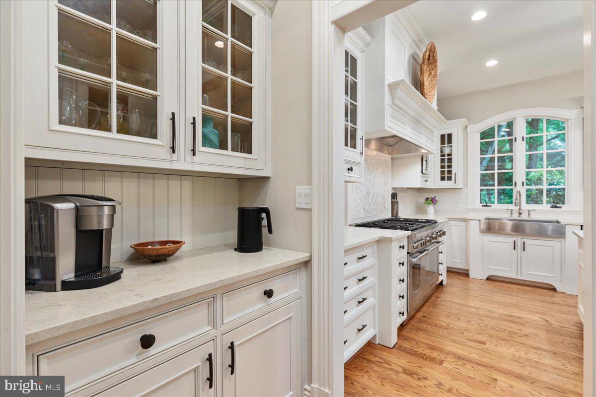 14915 Alpine Bay Loop Gainesville, VA 20155 - Photo 10 of 105 a kitchen with stainless steel appliances granite countertop a stove and a sink