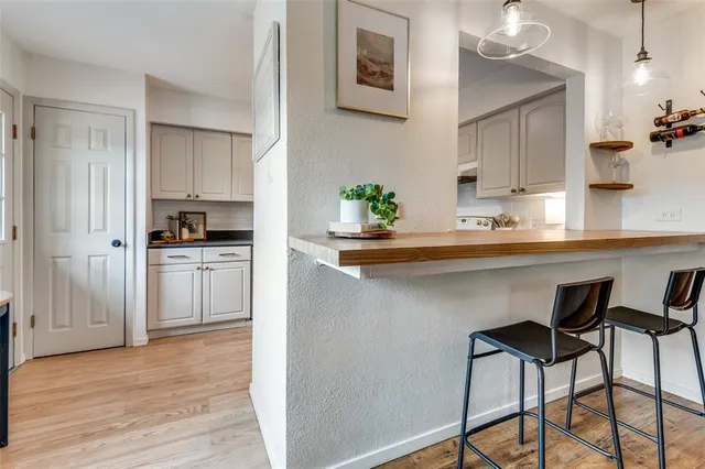 a kitchen with a sink cabinets and stainless steel appliances