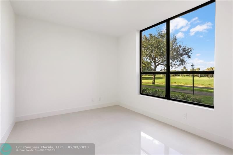 7145 Promenade Drive, Unit 101C Boca Raton, FL 33433 - Photo 11 of 23 a view of an empty room with a window