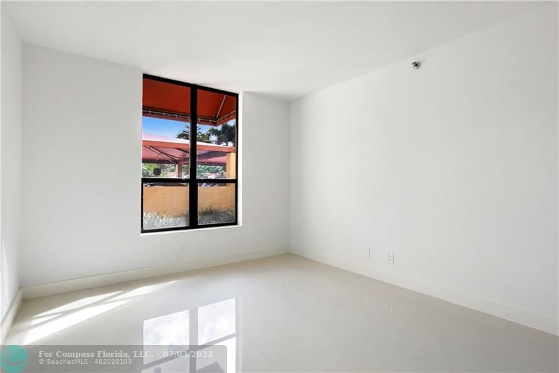 7145 Promenade Drive, Unit 101C Boca Raton, FL 33433 - Photo 13 of 23 a view of an empty room with a window