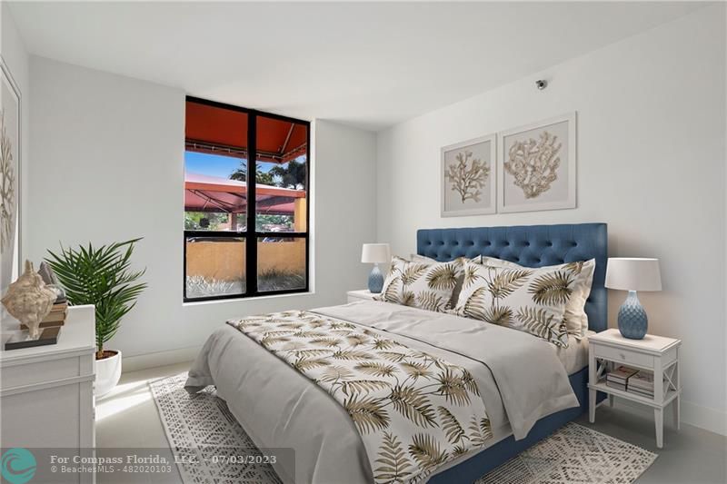 7145 Promenade Drive, Unit 101C Boca Raton, FL 33433 - Photo 14 of 23 a bedroom with a large bed and a window