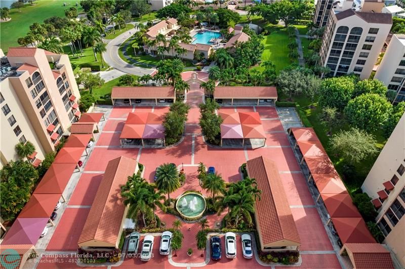 7145 Promenade Drive, Unit 101C Boca Raton, FL 33433 - Photo 22 of 23 an aerial view of a house with garden space and street view