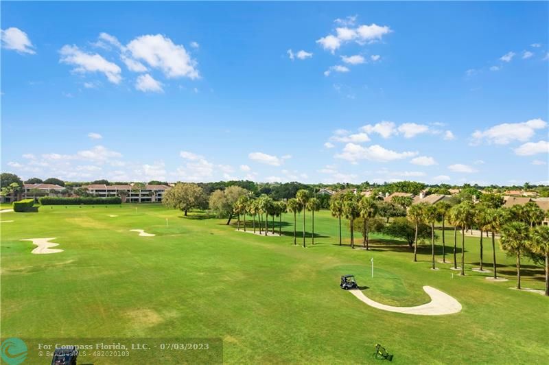 7145 Promenade Drive, Unit 101C Boca Raton, FL 33433 - Photo 23 of 23 a view of a golf course with a lake