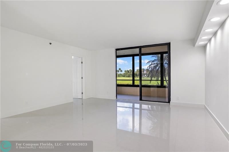 7145 Promenade Drive, Unit 101C Boca Raton, FL 33433 - Photo 5 of 23 a view of an empty room with a window