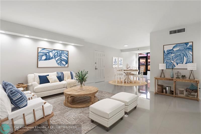 7145 Promenade Drive, Unit 101C Boca Raton, FL 33433 - Photo 7 of 23 a living room with furniture and a large window