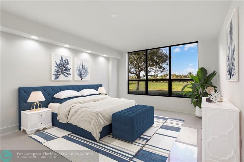 7145 Promenade Drive, Unit 101C Boca Raton, FL 33433 - Photo 10 of 23 a bedroom with a large bed and a large window