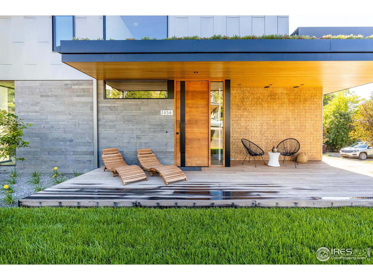 Indonesian Teak Wood Tiles,  Molten Lava exterior tiles &  Mahogany Solace Pivot Door with magnetic latch, Hemlock custom ceiling at porch