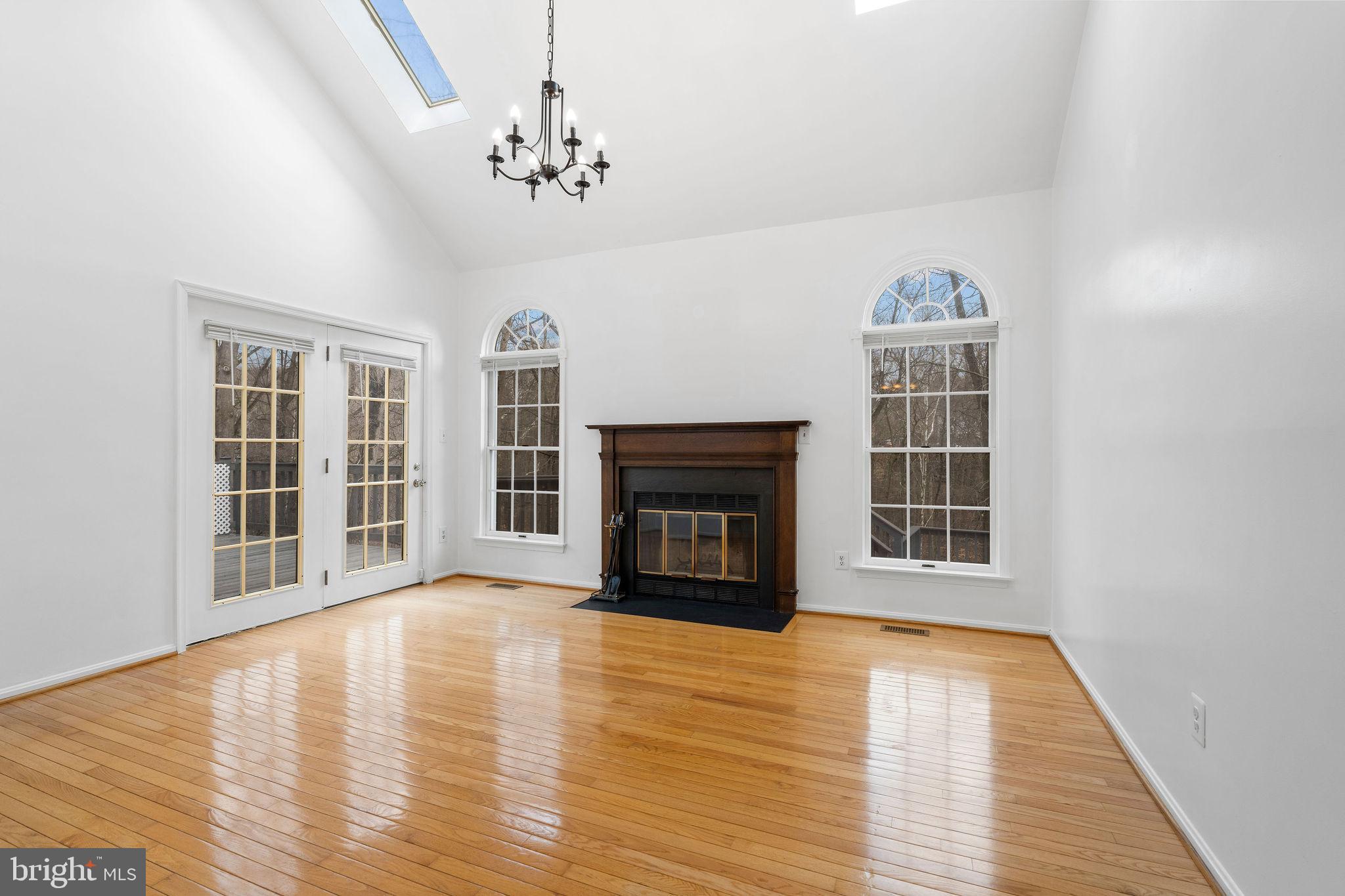 9301 Bellbeck Road Baltimore, MD 21234 - Photo 11 of 35 a view of an empty room with a window and fireplace