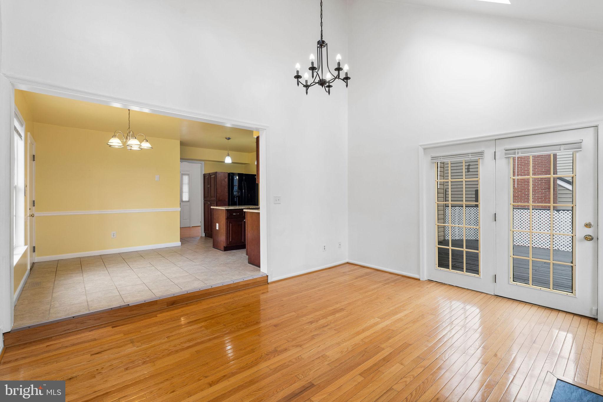 9301 Bellbeck Road Baltimore, MD 21234 - Photo 12 of 35 wooden floor in an empty room with a window