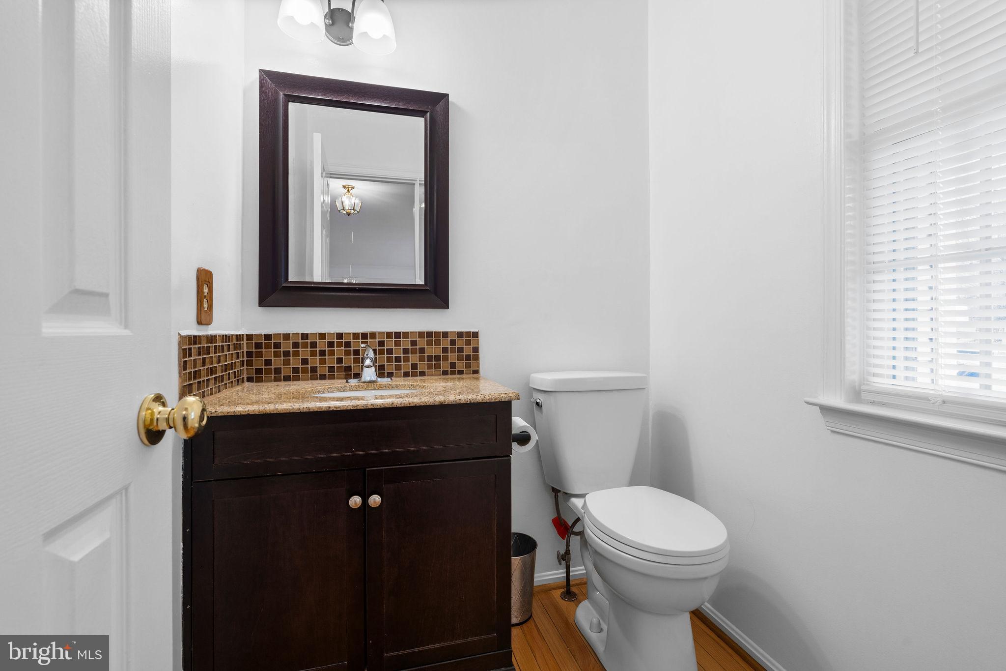 9301 Bellbeck Road Baltimore, MD 21234 - Photo 13 of 35 a bathroom with a sink and a toilet