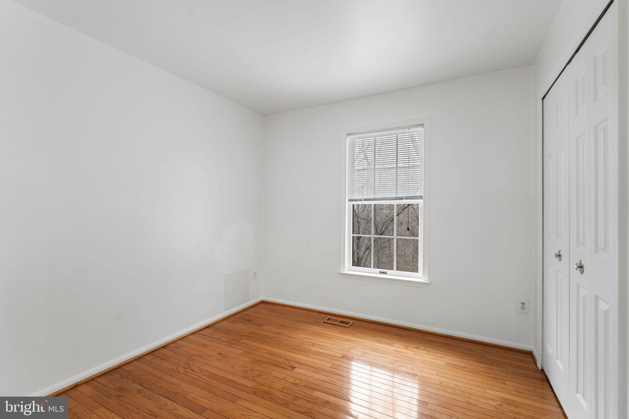 9301 Bellbeck Road Baltimore, MD 21234 - Photo 19 of 35 a view of empty room with wooden floor and fan