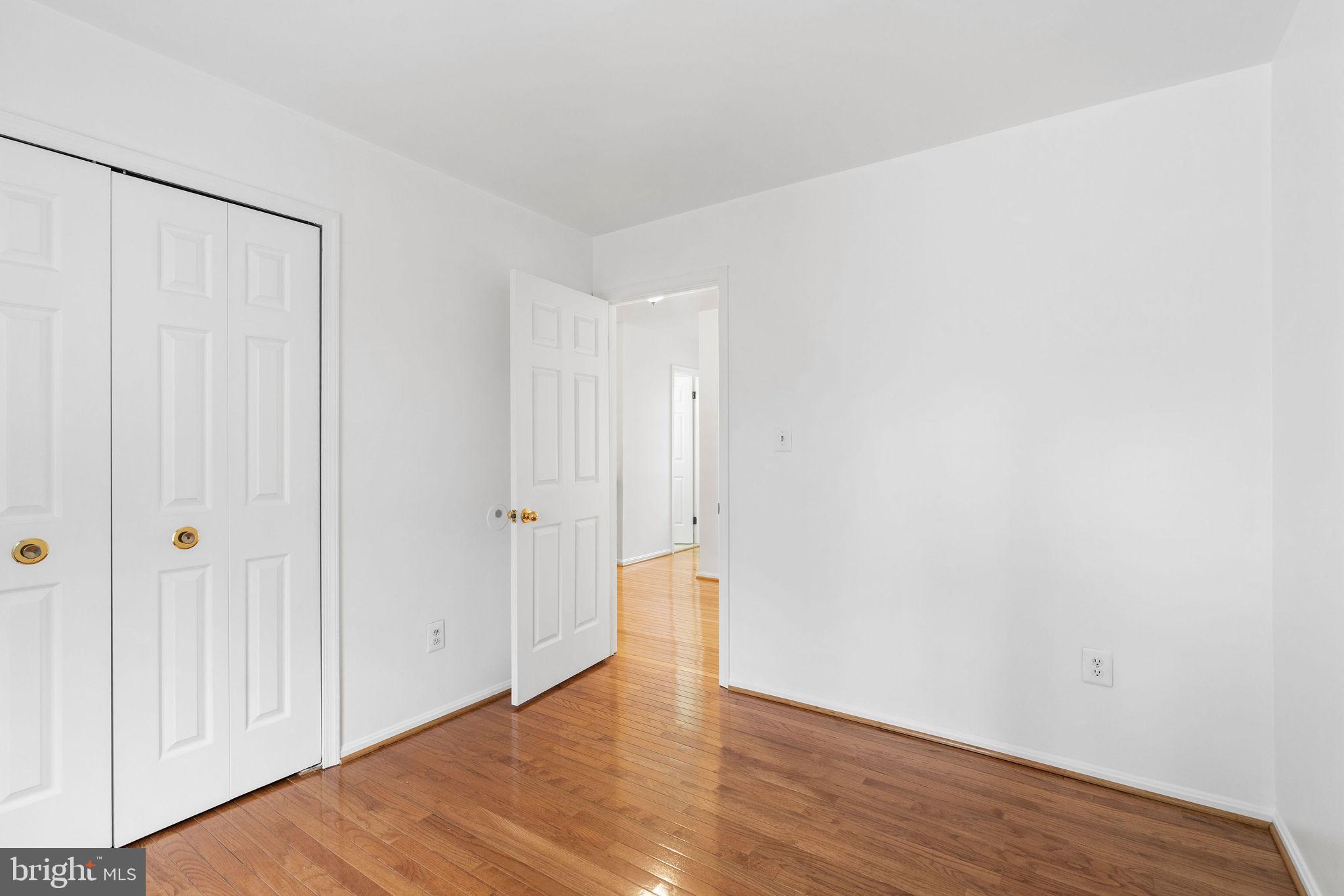 9301 Bellbeck Road Baltimore, MD 21234 - Photo 20 of 35 a view of an empty room with wooden floor