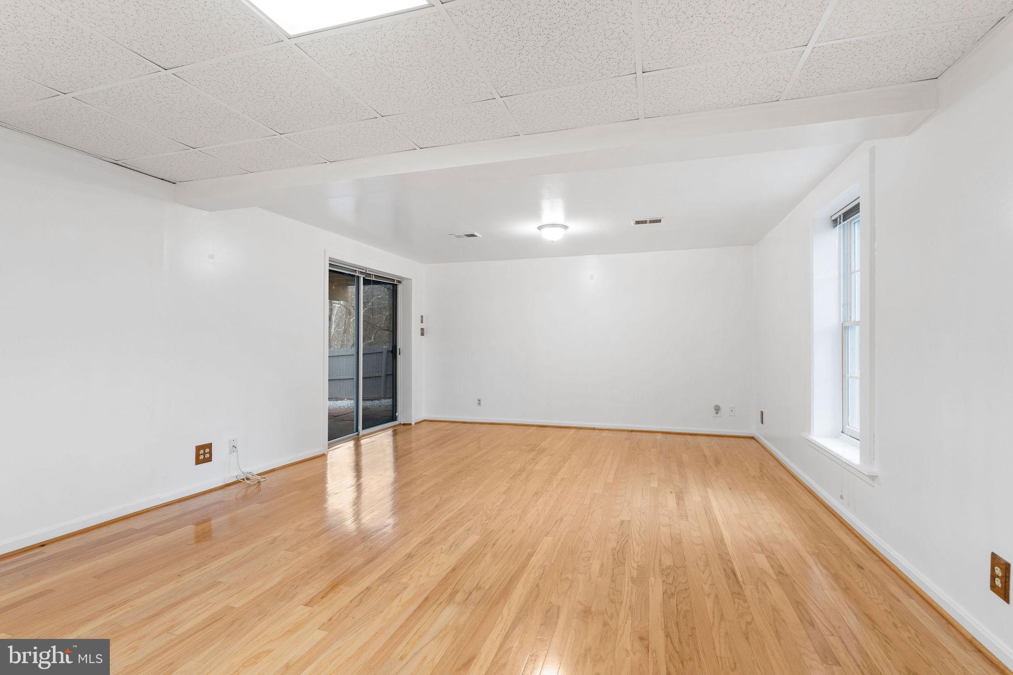 9301 Bellbeck Road Baltimore, MD 21234 - Photo 25 of 35 a view of an empty room with wooden floor