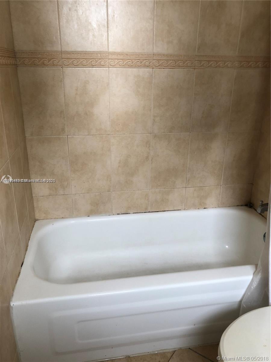 16909 North Bay Road, Unit 711 Sunny Isles Beach, FL 33160 - Photo 8 of 9 a bathroom with a bathtub