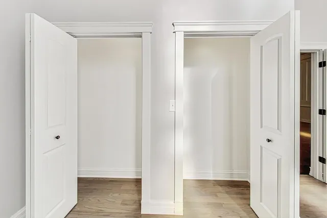 a view of a bathroom with wooden floor