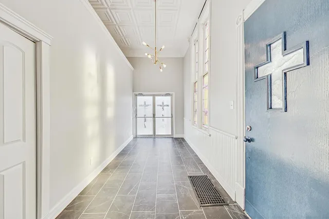 a view of a hallway with windows