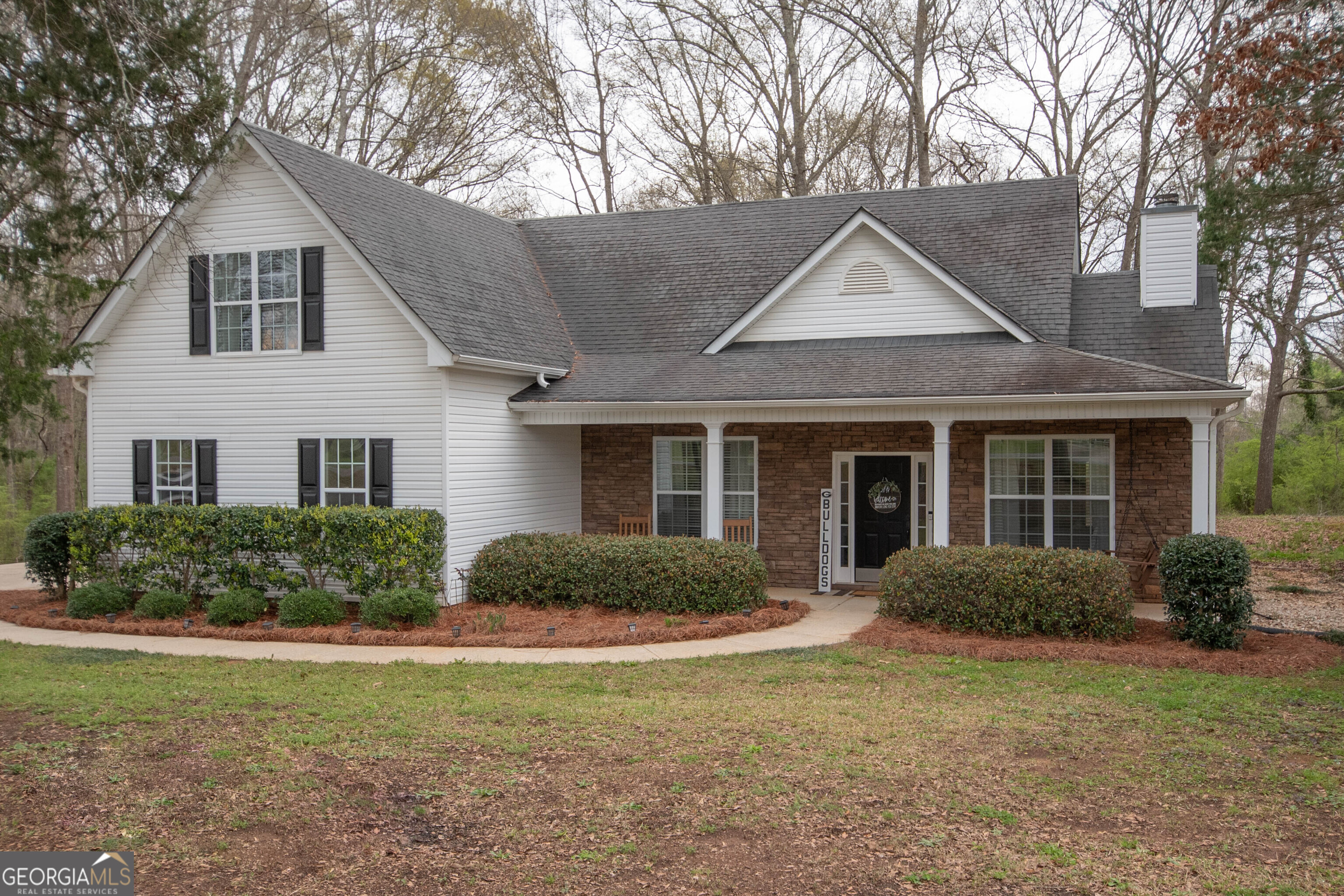 2487 Barnesville Road Griffin, GA 30224 - Photo 1 of 1 a front view of a house with yard and green space