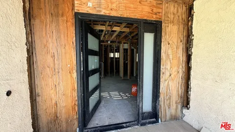 a view of an empty room with windows