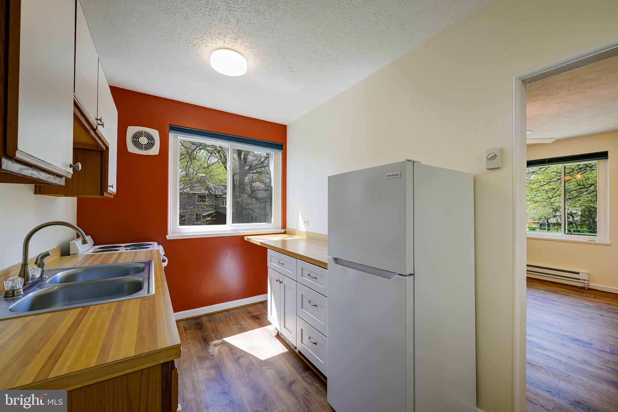 39 Ridge Road Greenbelt, MD 20770 - Photo 8 of 19 Sun soaked kitchen with a brand new fridge