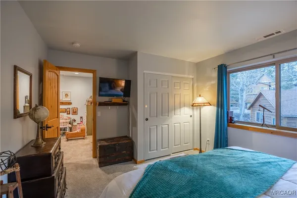 a bathroom with a granite countertop shower a mirror and a sink