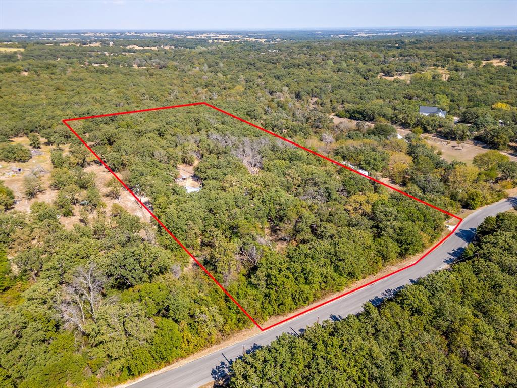436 Luke Road Springtown, TX 76082 - Photo 35 of 39 Aerial view of property's location with a forest and property boundaries highlighted