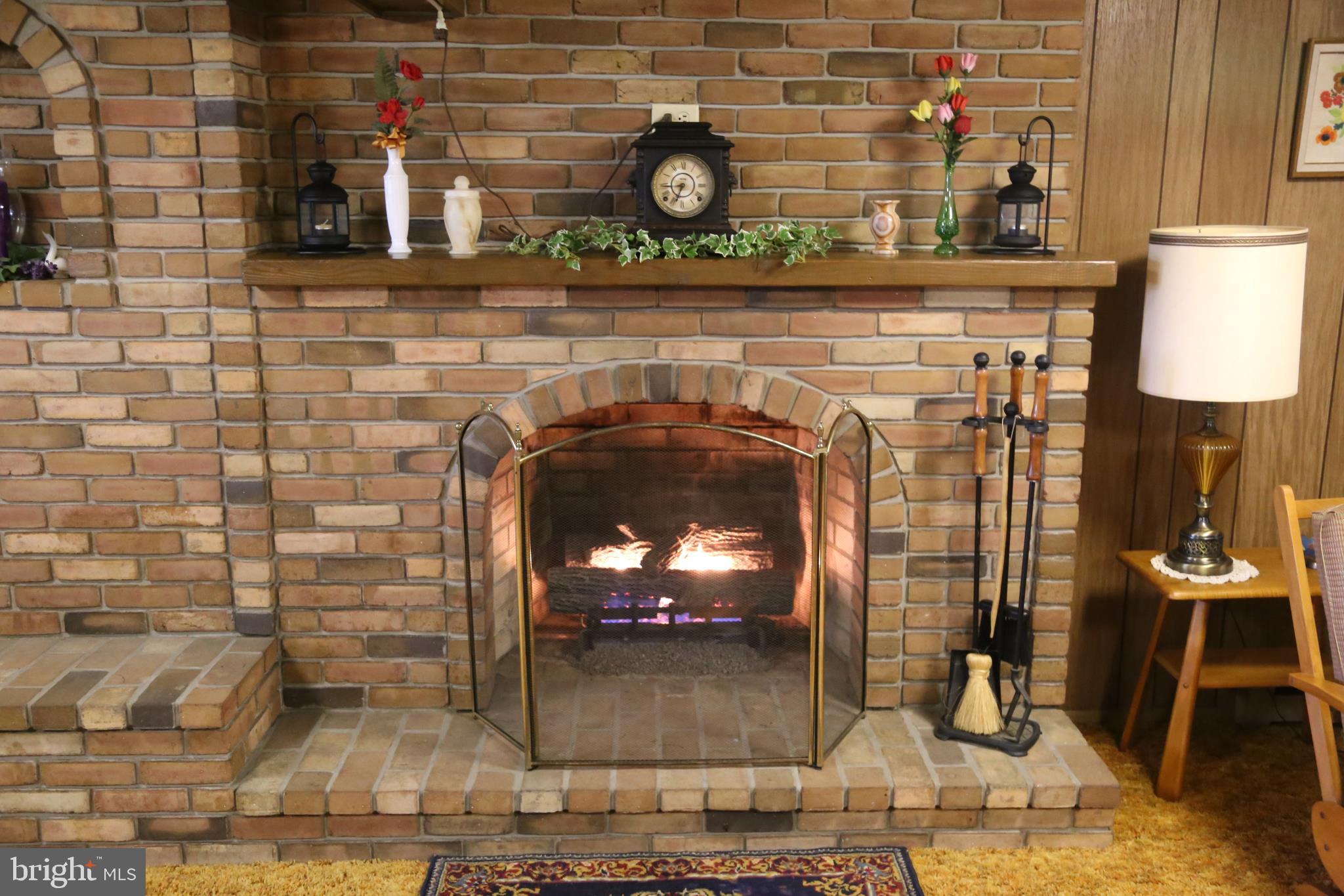 677 Lititz Road Manheim, PA 17545 - Photo 14 of 28 Brick fireplace with gas logs