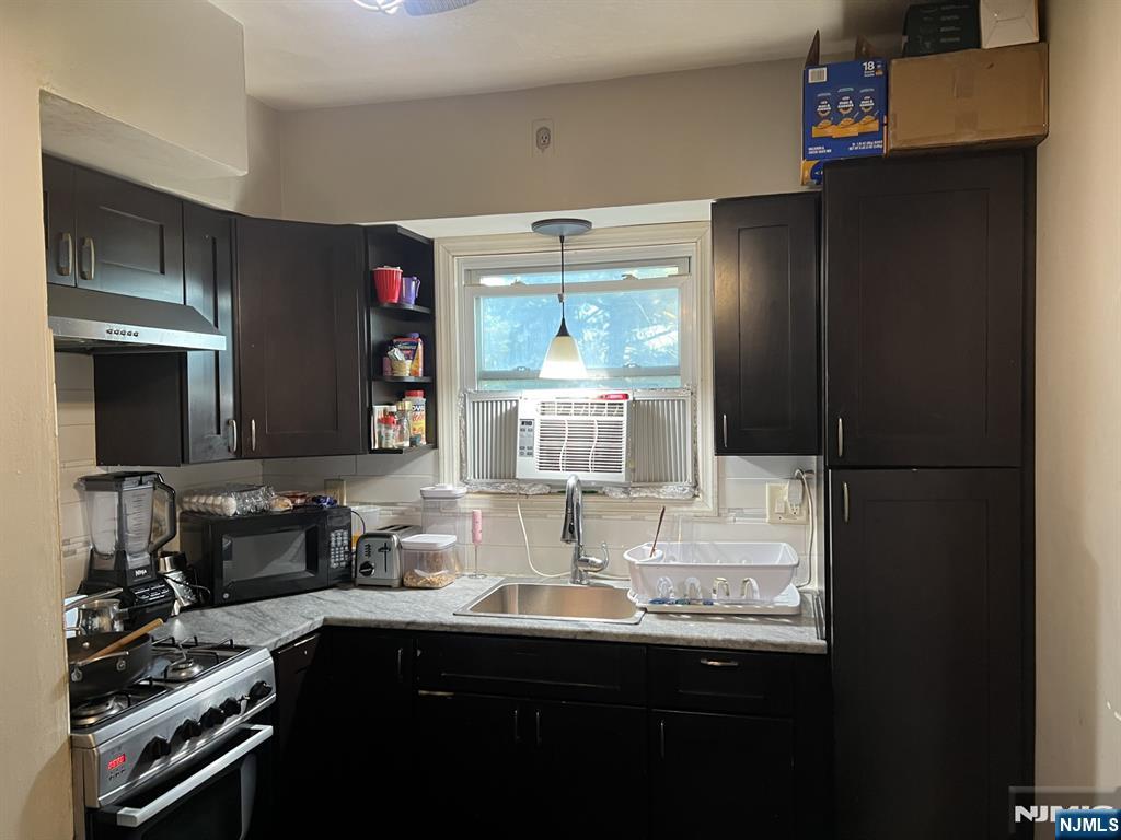 141 East 4th Street, Unit 2 Clifton, NJ 07011 - Photo 2 of 5 a kitchen with a sink and cabinets