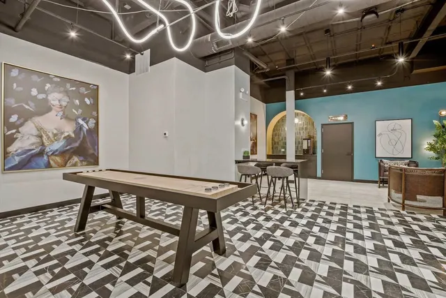 a kitchen with a table and chairs in it