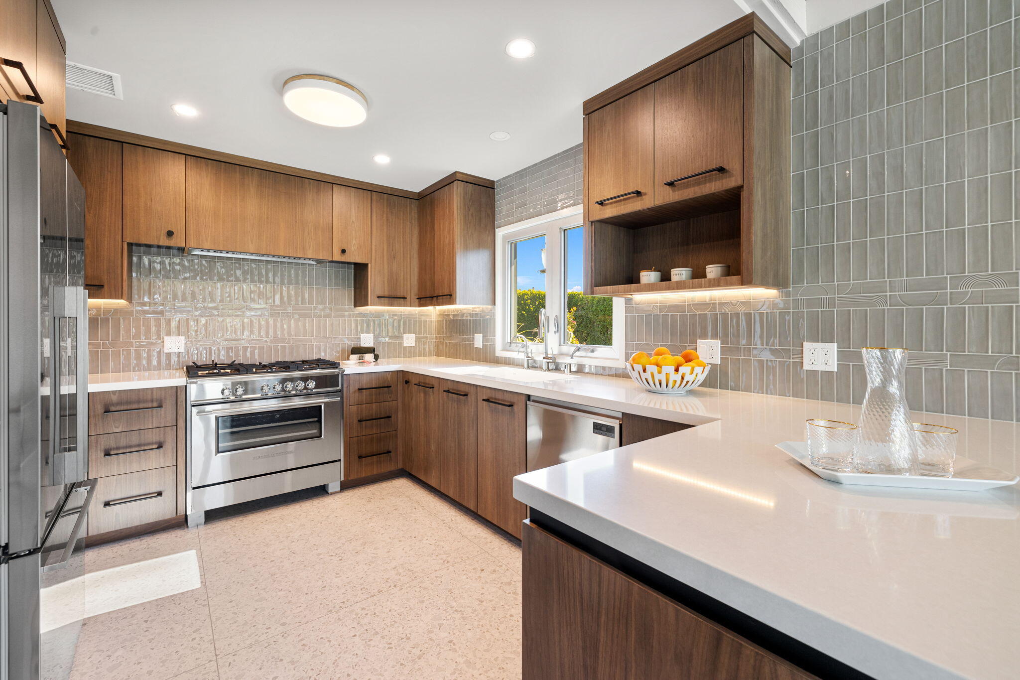 36903 Palm View Road Rancho Mirage, CA 92270 - Photo 12 of 58 a kitchen with a sink stove and microwave