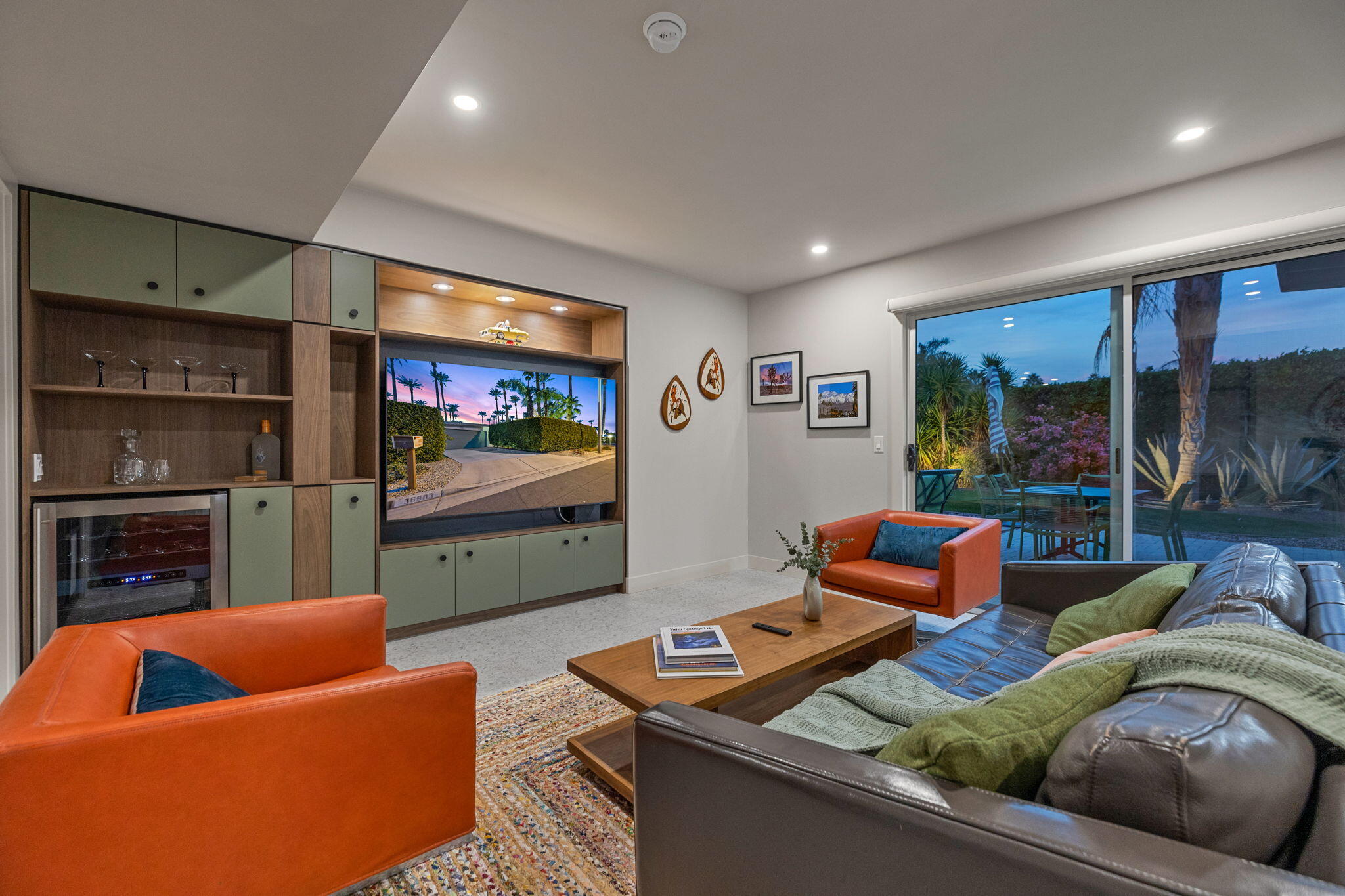 36903 Palm View Road Rancho Mirage, CA 92270 - Photo 18 of 58 a living room with furniture kitchen view and a fireplace