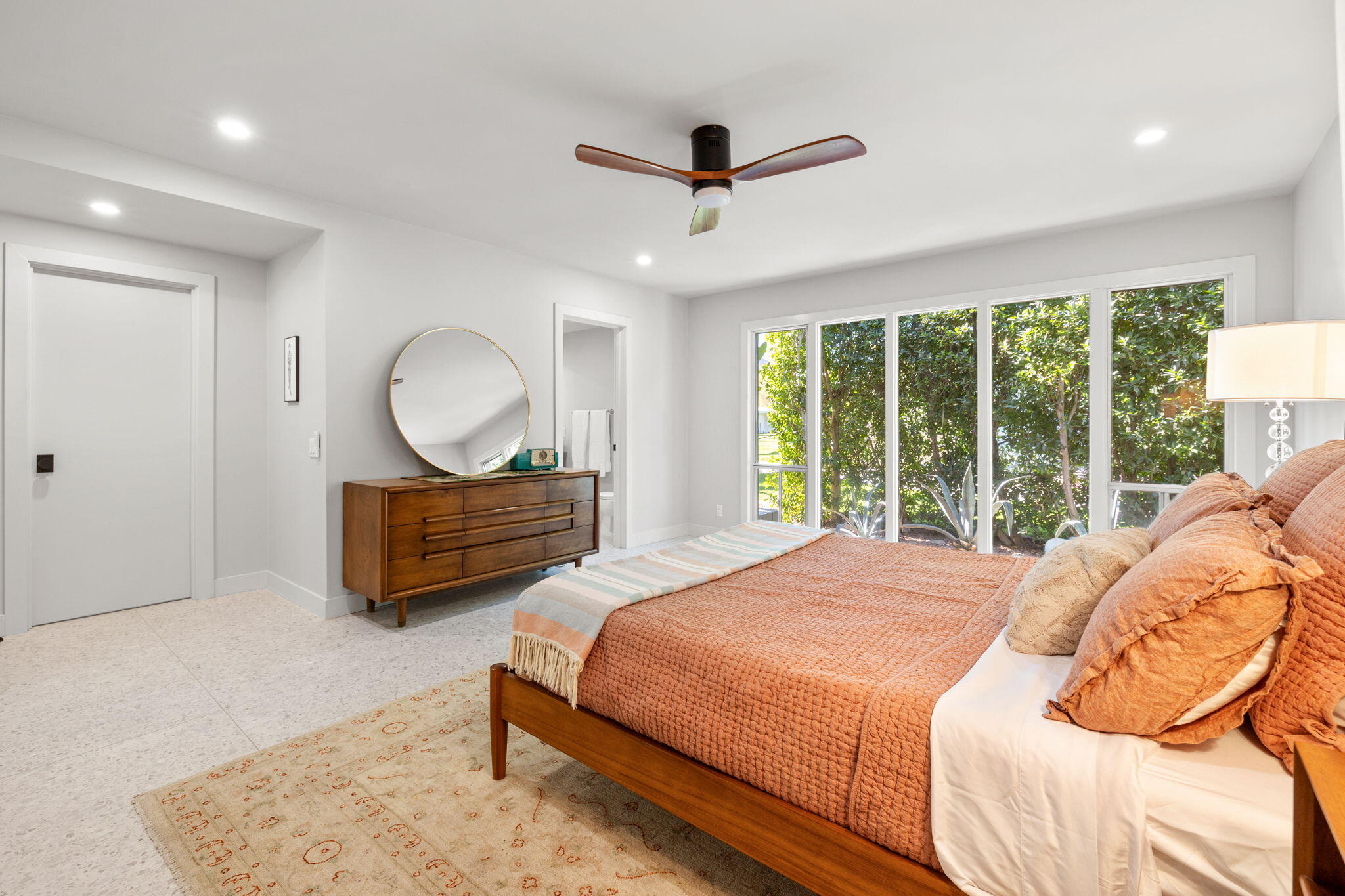 36903 Palm View Road Rancho Mirage, CA 92270 - Photo 23 of 58 a bedroom with a bed mirror and a large window