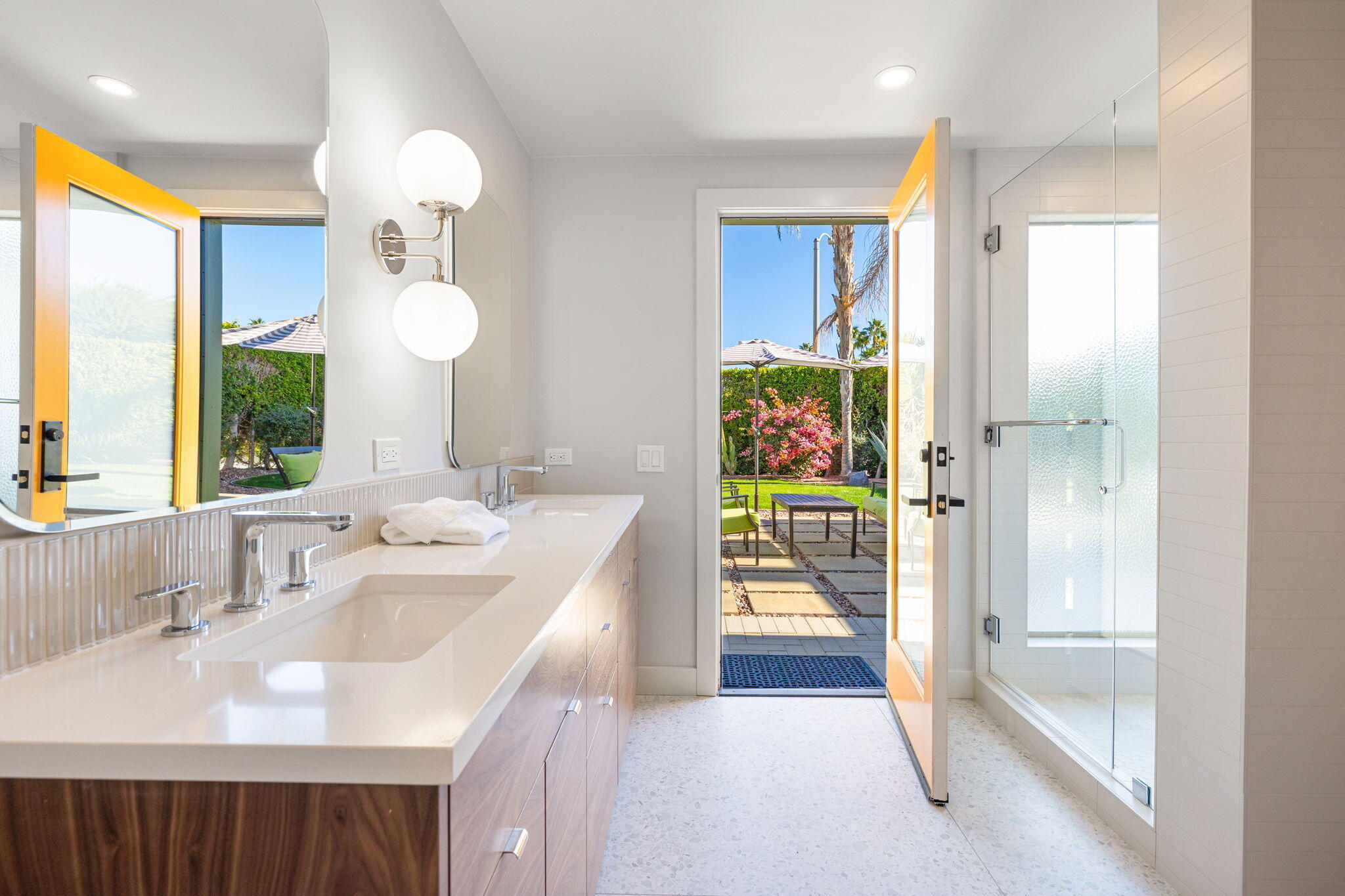 36903 Palm View Road Rancho Mirage, CA 92270 - Photo 30 of 58 a bathroom with a sink a mirror and a bathtub