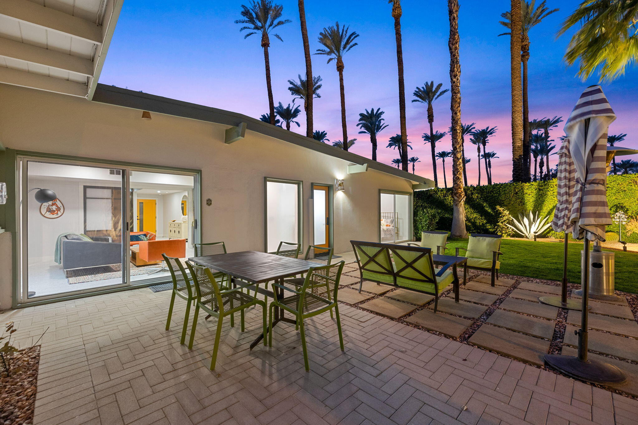 36903 Palm View Road Rancho Mirage, CA 92270 - Photo 43 of 58 a patio with glass top table and chairs