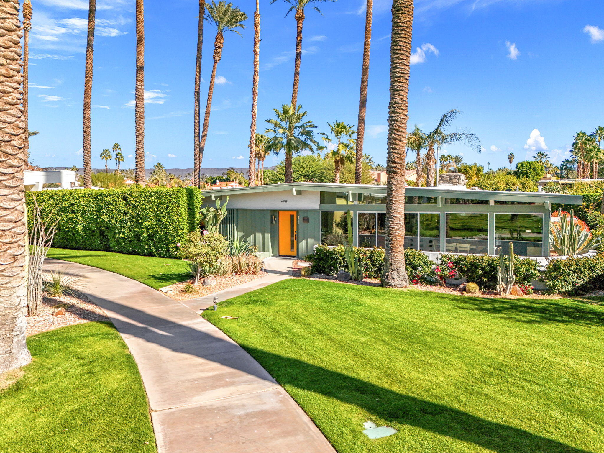 36903 Palm View Road Rancho Mirage, CA 92270 - Photo 49 of 58 a view of a house with a yard and sitting area