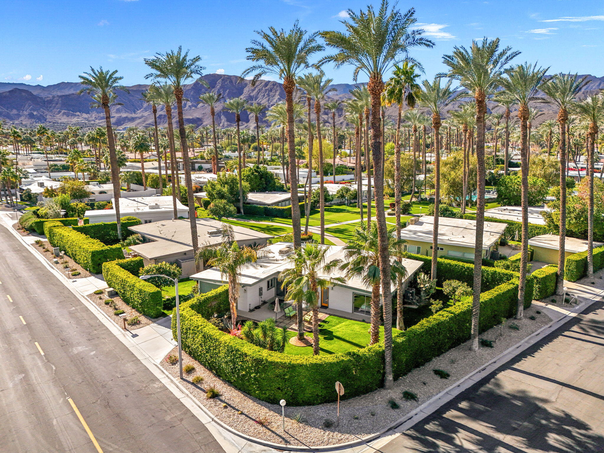 36903 Palm View Road Rancho Mirage, CA 92270 - Photo 52 of 58 a view of a swimming pool with a lounge chairs