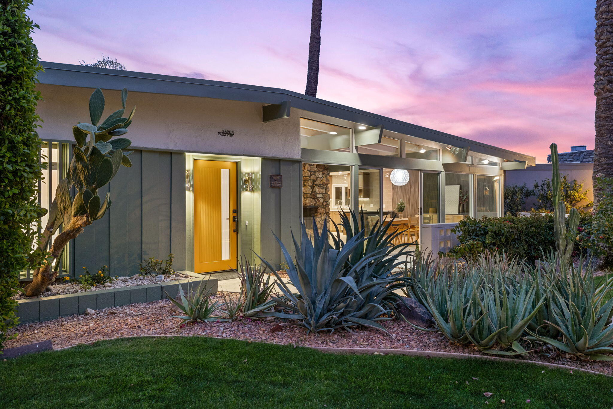 36903 Palm View Road Rancho Mirage, CA 92270 - Photo 54 of 58 a front view of a house with a yard
